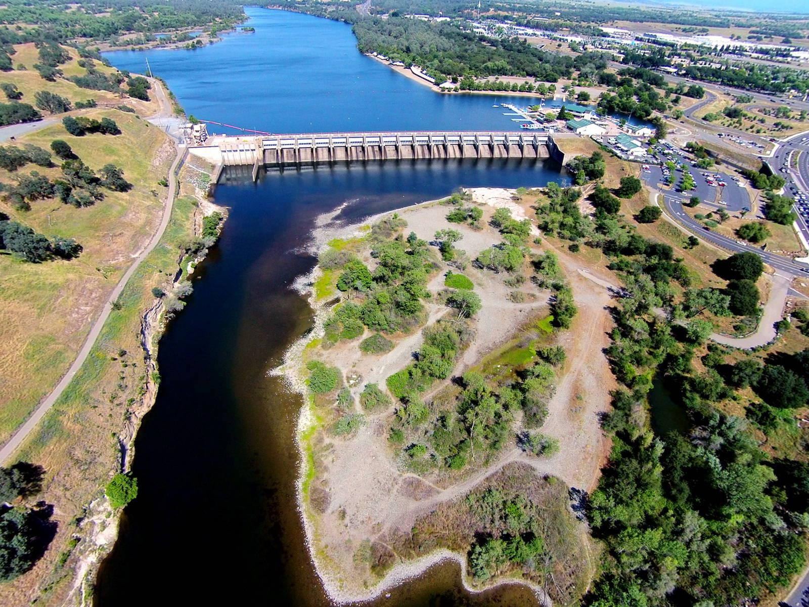 Aerial view of the lower American River and tree-lined banks in Sacramento County